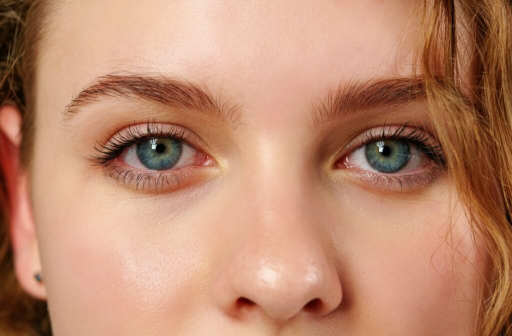 A close-up image of a woman with blue eyes.