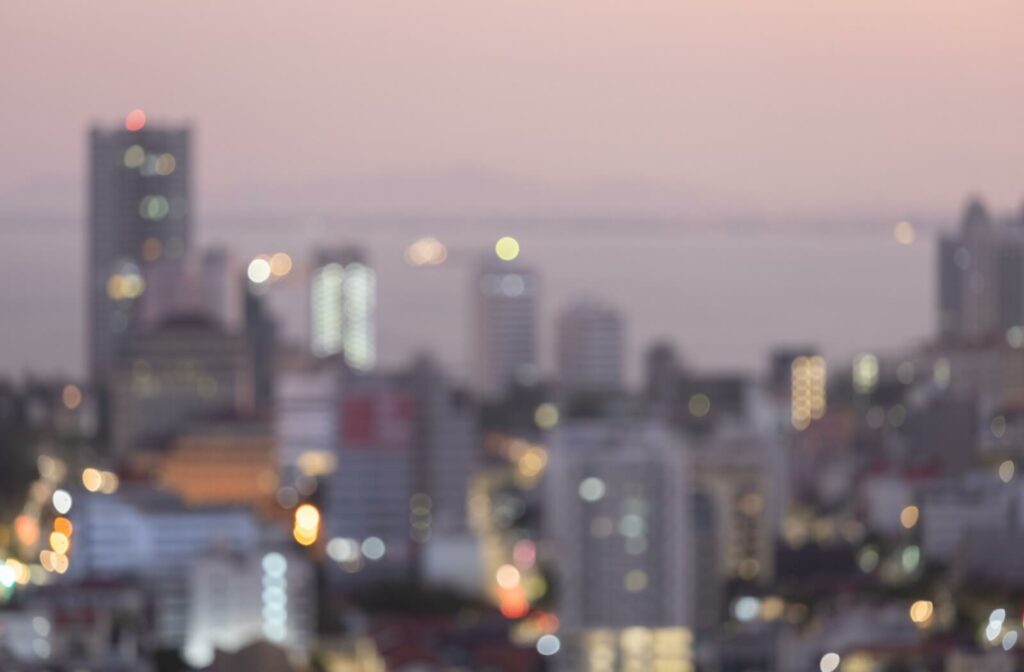 Blurry cityscape at sunset.